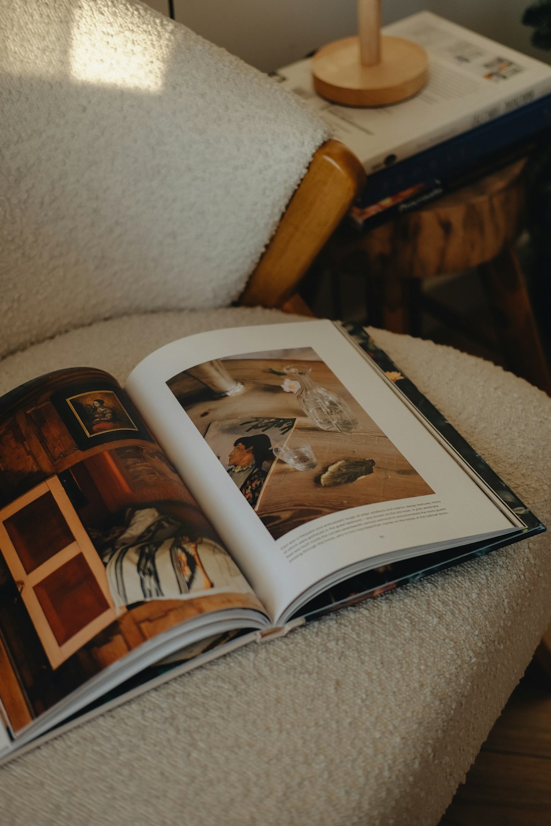Open book with images resting on a chair